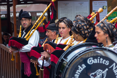 OVIEDO, Spain August 25, 2015: Group of bagpipers to parade through the streets to attract tourism in Oviedo, Spainのeditorial素材