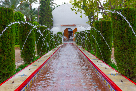 Fountain in rectangular pondの写真素材