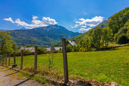 Small village and green meadow in the natural park of Ordesa in the Pyrenees, Huesca, Spainの写真素材