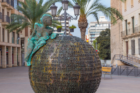 Sculpture of woman on sphere with lettersのeditorial素材