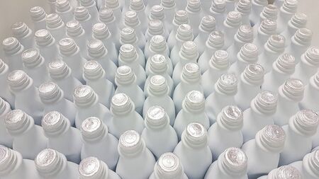 many white plastic bottles lined upの写真素材