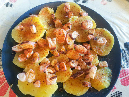 plate of roasted legs with octopus and paprika