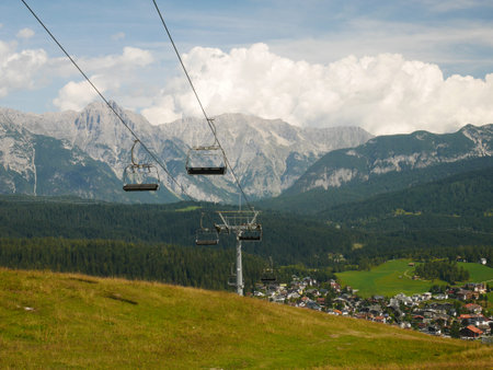 Seefeld in Tyrol, Austria with chairlift in foreground and mountains and clouds behind
