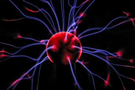 Close up plasma ball strands of blue violet purple and redの写真素材
