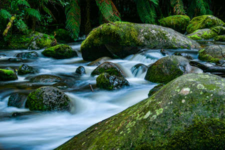 Close up of a river winding between the rocks and bouldersの写真素材