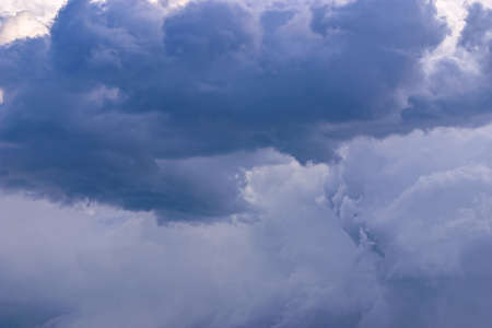 Deep dark blue grey menacing stormy cloudsの写真素材