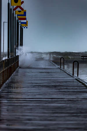 Stormy Seas at Frankston Pier Waves crashing through the boardsの写真素材