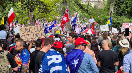 Melbourne, Victoria Australia - November 20 2021: Flagstaff Gardens Park Thousands of peaceful protestors gather fighting for Freedom and to Kill the Bill holding a sign for save our childrenのeditorial素材