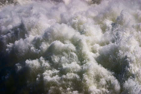Turbulent spraying water gushing from pressure outlet at Lake Hume damの写真素材