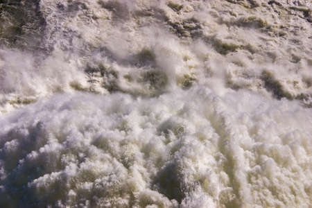 Close up of roaring water gushing from pressure outlet at Lake Hume damの写真素材