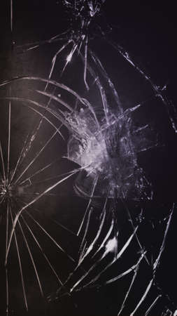 Grunge dark grainy texture with broken glass patternの写真素材
