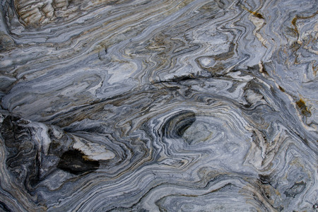 Closeup of a Marble Boulder with small pools of waterの写真素材