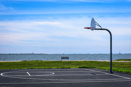 One side of a basketball court in a park.の写真素材