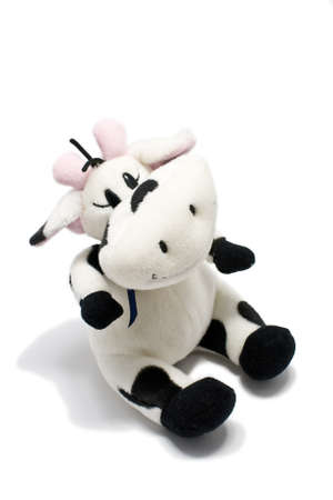 Cuddly stuffed cow toy isolated over a white background.の写真素材