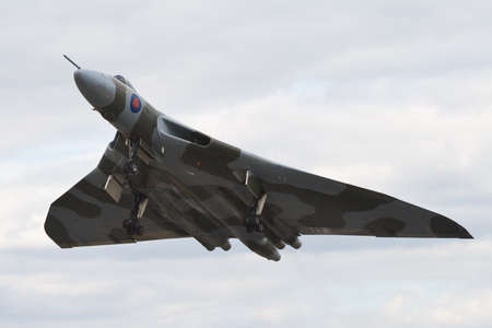 Farnborough, England, UK - July 24, 2010: Last flying Vulcan bomber B.2 XH558 at Farnborugh 2010 Airshow.のeditorial素材