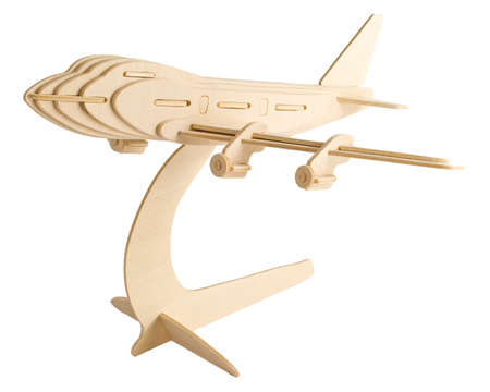 A balsa wood model jumbo jet isolated against a white backgroundの写真素材