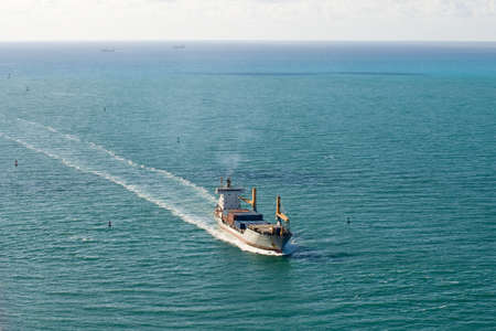 Miami, Florida, USA - May 4, 2012: A container ship starts the final part of its voyage as it steams towards the Port of Miami.のeditorial素材