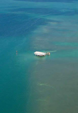 An isolated property built on stilts off the coast of Miami, Florida の写真素材