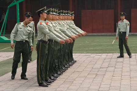 Beijing, China - May 16, 2009: A row of People's Liberation Army soldiers stand for inspection.のeditorial素材