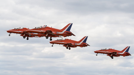 Farnborough, England, UK - July 24, 2010: The Royal Air Force aerobatic display team The Red Arrows begin their display at Farnborough 2010 Airshow.のeditorial素材