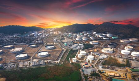 Panorama view of Oil and gas industrial refinery zone,Detail of equipment oil pipeline steel and large oil storage tank at twilight, Thailandの写真素材
