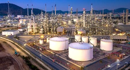 Oil refinery industry, Aerial view of petrochemical plant at duskの写真素材