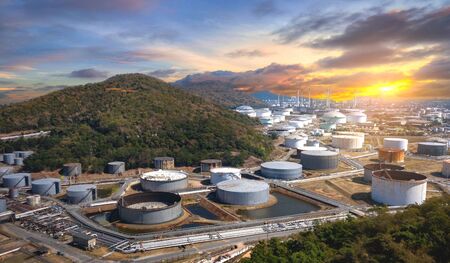 Panorama view of Oil and gas industrial refinery zone,Detail of equipment oil pipeline steel and large oil storage tank at sunset,Thailandの写真素材
