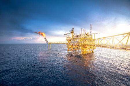 Large offshore drilling oil rig plant in the gulf at twilight.の写真素材