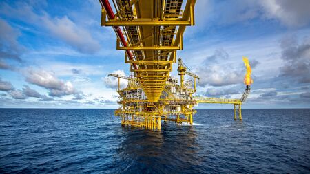 Offshore oil and gas platforms are in the process of releasing gas to the flame platform to reduce the pressure in the production process and forward the converted refinery. For the petroleum industryの写真素材