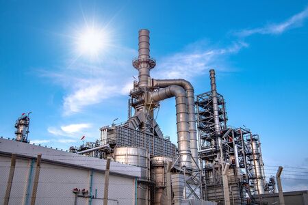 Close up Industrial view at oil refinery plant form industry zone with sunrise and cloudy skyの写真素材