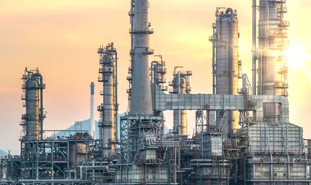 Oil and gas industrial refinery zone,Detail of equipment oil pipeline steel with valve from large oil storage tankの写真素材