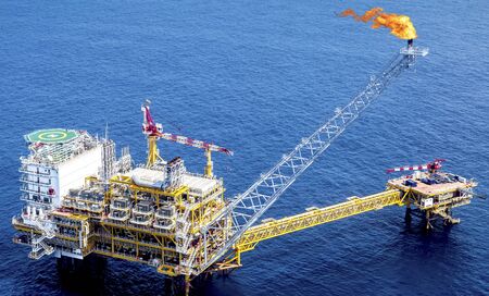 Aerial view industrial offshore oil and rig drilling platform in the gulf.の写真素材