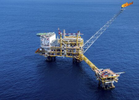 Aerial view industrial offshore oil and rig drilling platform in the gulf.の写真素材