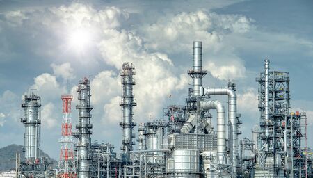 Close up Industrial view at oil refinery plant form industry zone with sunrise and cloudy skyの写真素材