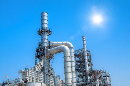 Oil and gas industrial refinery zone,Detail of equipment oil pipeline steel with valve from large oil storage tankの写真素材