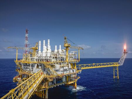 Offshore oil and gas platforms are in the process of releasing gas to the flame platform to reduce the pressure in the production process and forward the converted refinery. For the petroleum industryの写真素材