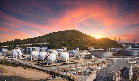 Panorama view of Oil and gas industrial refinery zone,Detail of equipment oil pipeline steel and large oil storage tank at twilight, Thailandの写真素材
