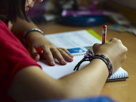 student girl doing her homework,の写真素材
