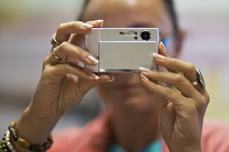 lady taking  photograph with small camera