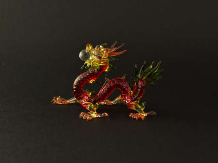 glass dragon on black backgroundの写真素材