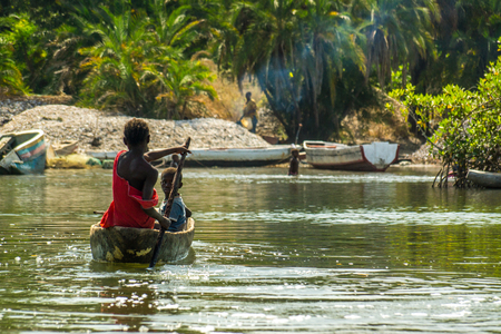 African children practice canoeing in the River Gambia near Makasutu forest in Gambia, West Africaの写真素材