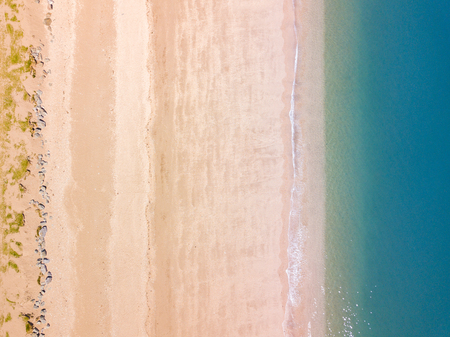 An aerial drone  photograph taken looking straight down on Slaptop Sands in Devon, UKの写真素材