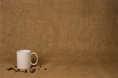 Coffee Mug Background   White mug and beans on burlap   Copy space の写真素材