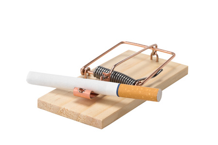 Cigarette as bait in a mousetrap.  Studio close up isolated on a white background.の写真素材