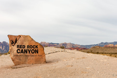 Red Rock Canyon National Conservation Area Sign in Nevada.  Desert mountains in the background and copy space in the sky if needed.のeditorial素材