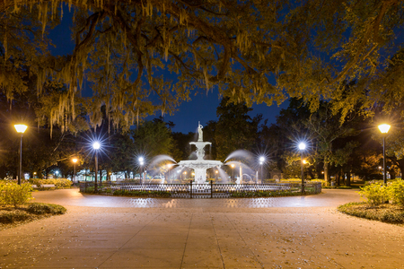 Water fountain at night - Forsyth fountain in historic Savannah, Georgia.  Dramatic view with lots of star bursts and water spray.のeditorial素材