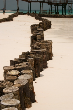 Wave breaker trail on white beach zanzibarの写真素材
