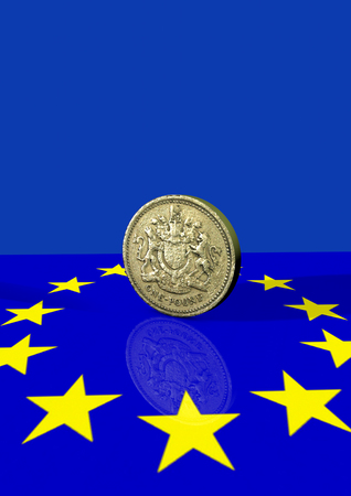 Pound coin and euro flagの写真素材