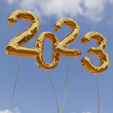 2023 gold foil balloons on blue sky