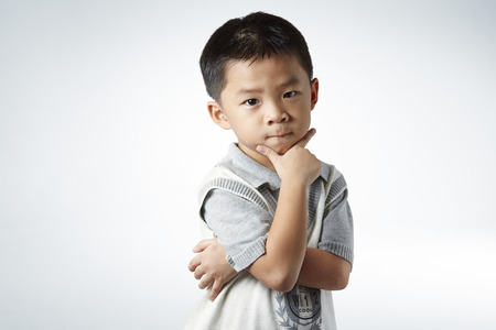 little boy smart poseの写真素材